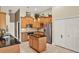 Well-equipped kitchen with wooden cabinets, stainless steel appliances, and a center island at 873 Gulf Land Dr, Apopka, FL 32712