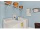Laundry room with a washer and dryer, wire shelving, and light blue walls for efficient chore management at 873 Gulf Land Dr, Apopka, FL 32712