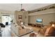 Cozy living room with a large sliding glass door, comfortable seating, and decorative elements at 873 Gulf Land Dr, Apopka, FL 32712
