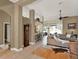 Open-concept living area with tile and wood flooring, high ceilings, and neutral-colored walls at 873 Gulf Land Dr, Apopka, FL 32712