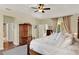 Spacious bedroom with hardwood floors, ensuite bath, and generous closet space at 873 Gulf Land Dr, Apopka, FL 32712