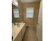 Bathroom with tile floor featuring a vanity, toilet, and tub at 8775 Sartori St # 303, Orlando, FL 32829