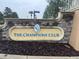 Elegant stone signage at The Champions Club community entrance creates a great first impression for residents and visitors at 8950 Azalea Sands Ln # 8950, Champions Gate, FL 33896