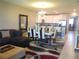 Inviting living room and dining area with stylish decor, providing a comfortable space for relaxation and entertaining at 8950 Azalea Sands Ln # 8950, Champions Gate, FL 33896