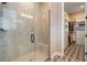 Beautiful walk-in shower and a glimpse into the organized walk-in closet at 896 Tilden Oaks Trl, Winter Garden, FL 34787
