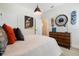 Well-designed bedroom featuring a large clock, skateboard decor, and warm, inviting colors at 896 Tilden Oaks Trl, Winter Garden, FL 34787