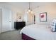 Bright bedroom boasts a modern dresser, stylish light fixture, and tasteful floral art at 896 Tilden Oaks Trl, Winter Garden, FL 34787