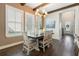 Elegant dining room with wood floors, natural light, and stylish chandelier at 896 Tilden Oaks Trl, Winter Garden, FL 34787