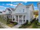 An inviting exterior view of a two-story home with a covered front porch and charming curb appeal at 896 Tilden Oaks Trl, Winter Garden, FL 34787