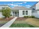 Charming single-Gathering home with a well-manicured front yard and inviting front porch at 896 Tilden Oaks Trl, Winter Garden, FL 34787