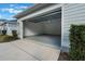 Clean and spacious garage with epoxy flooring and ample storage space at 896 Tilden Oaks Trl, Winter Garden, FL 34787