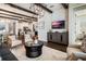 Comfortable living room with modern decor, wood beams, and an open floor plan at 896 Tilden Oaks Trl, Winter Garden, FL 34787
