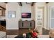 Cozy living room with a wall-mounted TV, modern decor, and hardwood floors at 896 Tilden Oaks Trl, Winter Garden, FL 34787