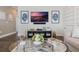 Stylish living room with chic decor, modern entertainment setup, and a glass-top coffee table at 896 Tilden Oaks Trl, Winter Garden, FL 34787