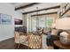 Comfortable living room with a large window, modern decor, and stylish furnishings at 896 Tilden Oaks Trl, Winter Garden, FL 34787