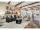 Inviting living room with stylish furnishings, wood beam ceiling, and open layout at 896 Tilden Oaks Trl, Winter Garden, FL 34787