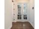 Office entrance featuring hardwood floors, a glass door and modern fixtures at 896 Tilden Oaks Trl, Winter Garden, FL 34787
