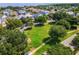 A lush community park featuring mature trees, green grass, and pedestrian walkways at 896 Tilden Oaks Trl, Winter Garden, FL 34787