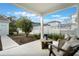 Covered patio with comfortable seating offers a relaxing outdoor space with a view of the backyard at 896 Tilden Oaks Trl, Winter Garden, FL 34787