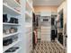 Well-organized walk-in closet with shelves, drawers, and ample storage space at 896 Tilden Oaks Trl, Winter Garden, FL 34787