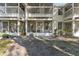 Rear view of the screened-in lanais and private backyards for this multi-unit building at 923 Lexington Pkwy # 14, Apopka, FL 32712