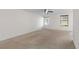 Spacious carpeted bedroom featuring two windows and ample natural light at 923 Lexington Pkwy # 14, Apopka, FL 32712