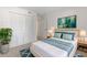 Bright bedroom with a comfortable bed, neutral tones, and modern accents at 923 Lexington Pkwy # 14, Apopka, FL 32712