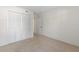 Carpeted bedroom with closet and view to the entry way at 923 Lexington Pkwy # 14, Apopka, FL 32712
