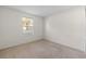 Bedroom with neutral carpet, bright window, and light walls at 923 Lexington Pkwy # 14, Apopka, FL 32712