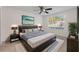 Beautiful bedroom with dark wood bed frame and nightstands, plush rug and ample light at 923 Lexington Pkwy # 14, Apopka, FL 32712
