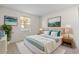 Serene bedroom with calming decor, a plush bed, and ample natural light from the window at 923 Lexington Pkwy # 14, Apopka, FL 32712