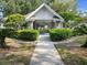 Exterior of clubhouse showing attractive stone accents, peaked roof, and nice landscaping at 923 Lexington Pkwy # 14, Apopka, FL 32712