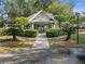 Community building with stone pillars and well-maintained landscaping at 923 Lexington Pkwy # 14, Apopka, FL 32712
