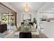 Elegant dining room featuring a glass table, stylish chairs, and a modern chandelier at 923 Lexington Pkwy # 14, Apopka, FL 32712