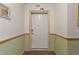 Welcoming entryway featuring a secure front door and classic trim at 923 Lexington Pkwy # 14, Apopka, FL 32712