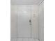 Image shows a white front door with gold hardware and square panels, next to a white closet door at 923 Lexington Pkwy # 14, Apopka, FL 32712