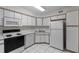 Clean kitchen with white cabinets, modern appliances, and ample counter space at 923 Lexington Pkwy # 14, Apopka, FL 32712