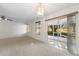 Sun-filled living room with sliding glass doors leading to the screened lanai at 923 Lexington Pkwy # 14, Apopka, FL 32712