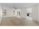 Image of living room featuring carpet, white walls, windows, and ceiling fan at 923 Lexington Pkwy # 14, Apopka, FL 32712