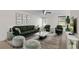 Stylish living room with modern green furniture, chic glass tables, and a cozy rug at 923 Lexington Pkwy # 14, Apopka, FL 32712