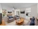 Inviting living room with cozy seating, neutral tones, and a view into the kitchen at 923 Lexington Pkwy # 14, Apopka, FL 32712