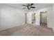 Carpeted main bedroom with ceiling fan and attached bathroom and closet at 923 Lexington Pkwy # 14, Apopka, FL 32712