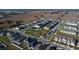 Community aerial view of a well maintained neighborhood with pool, playground and open space in a residential area at 1114 Turquoise Waves Cv, Kissimmee, FL 34747
