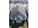 Bird's eye view of a home featuring a dark roof, manicured lawn, and fenced backyard at 1114 Turquoise Waves Cv, Kissimmee, FL 34747