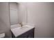 Vanity with a white countertop and brushed gold hardware at 1114 Turquoise Waves Cv, Kissimmee, FL 34747