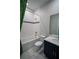 Bright bathroom features a shower-tub combo with elegant gold fixtures and marble tiling at 1114 Turquoise Waves Cv, Kissimmee, FL 34747
