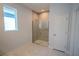 Modern bathroom featuring a glass-enclosed shower and marble tile flooring at 1114 Turquoise Waves Cv, Kissimmee, FL 34747