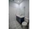 Bathroom featuring a toilet, sink, and brushed gold hardware at 1114 Turquoise Waves Cv, Kissimmee, FL 34747