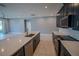 Gourmet kitchen featuring a large island, stainless steel appliances, and stylish finishes throughout at 1114 Turquoise Waves Cv, Kissimmee, FL 34747