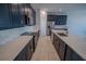 Modern kitchen with sleek appliances, ample counter space, and dark blue cabinets at 1114 Turquoise Waves Cv, Kissimmee, FL 34747